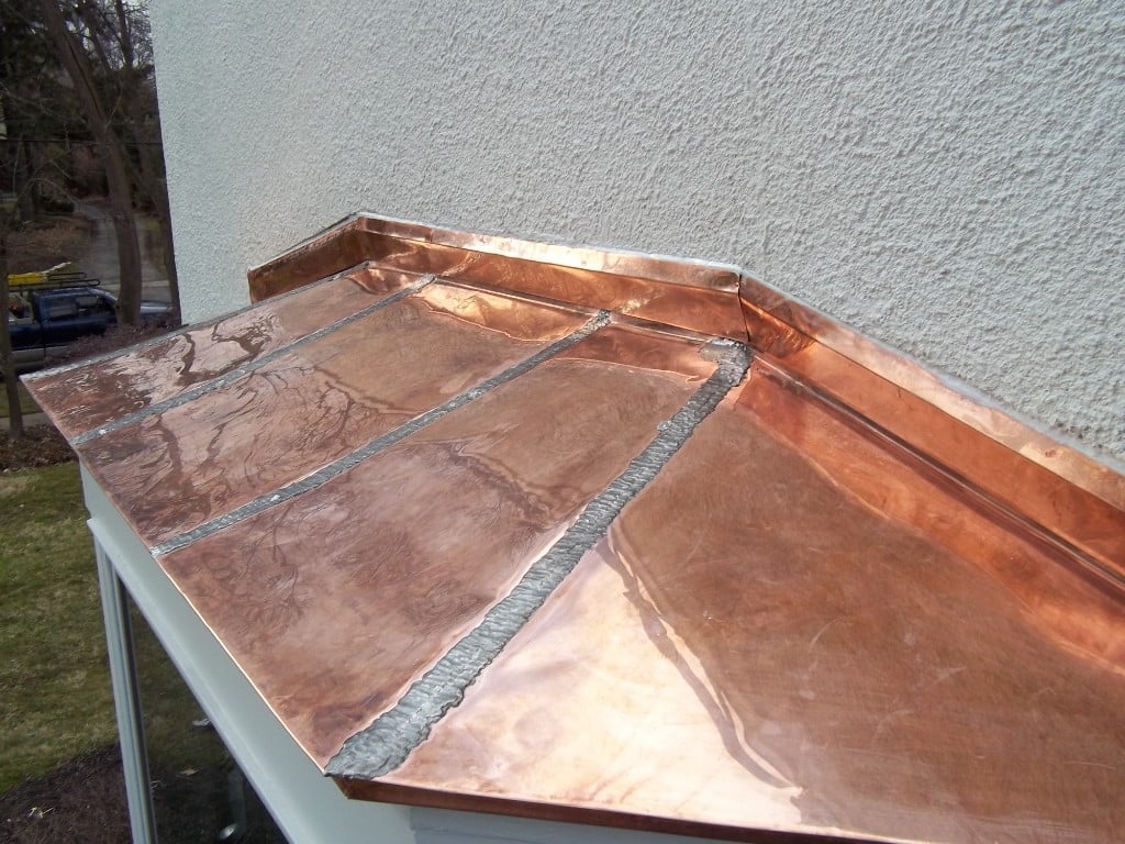 Soldered copper bay window roof on a residential home